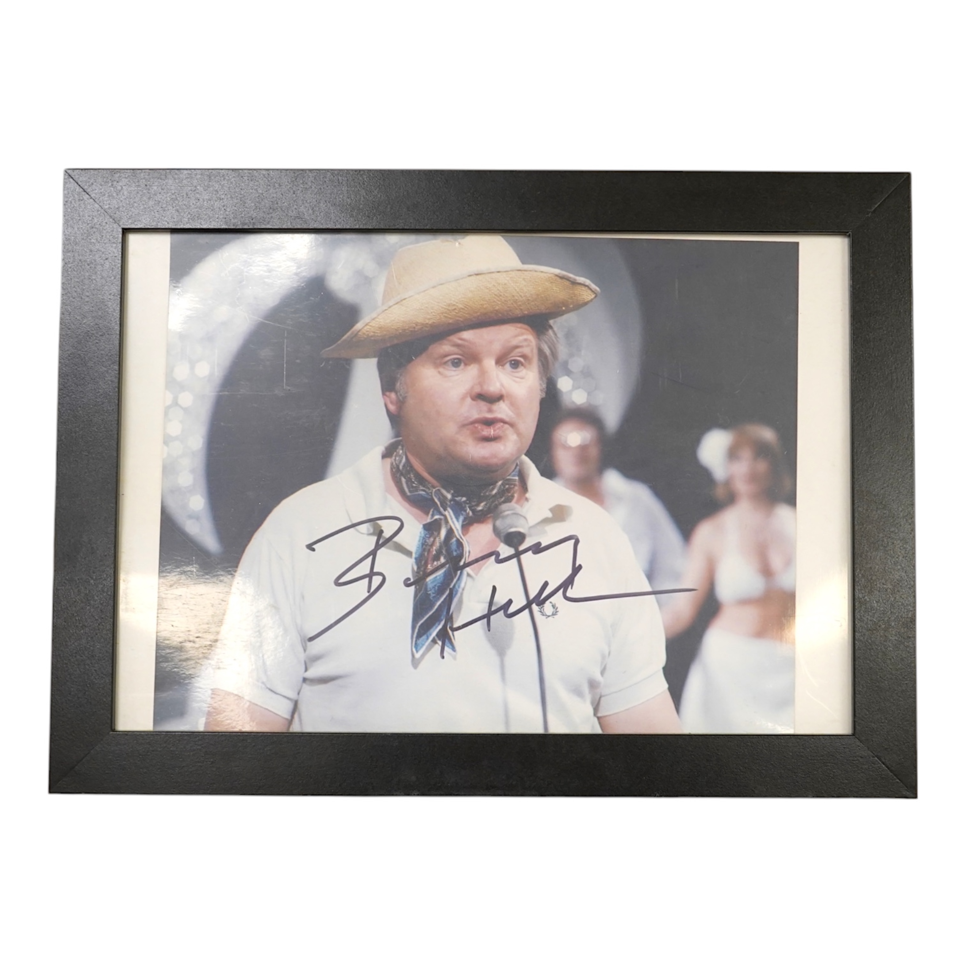 A signed photograph of Benny Hill, framed. Condition - good